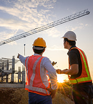 Two construction workers on a job site